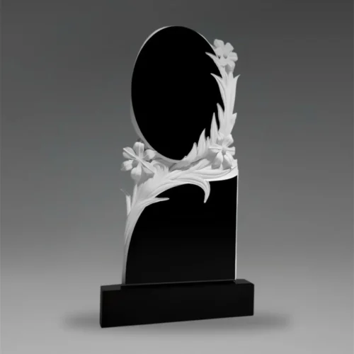 Tablica nagrobna granitowa z okrągłym elementem i rzeźbionymi kwiatami A57