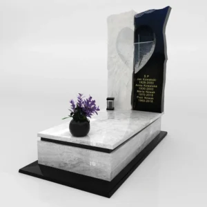 nagrobek z białego i czarnego granitu z sercem i krzyżem