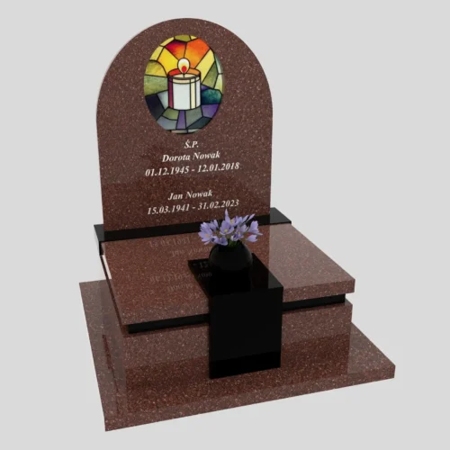 Pomnik urnowy ozdobiony witrażem z motywem świecy wykonany z granitu tokowski
